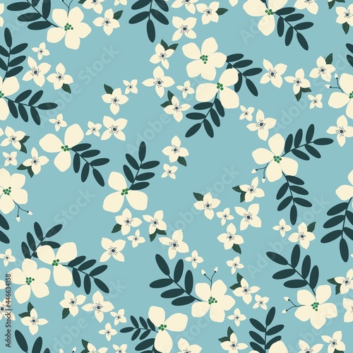 Vintage floral background. Seamless pattern for design and fashion prints. The flowers are milky with dark leaves on a light blue background.