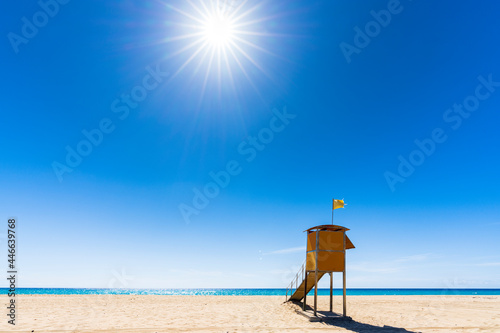 Sun shining over the lifeguard's cabin by the ocean, Morro Jable, Fuerteventura, Canary Islands, Spain photo