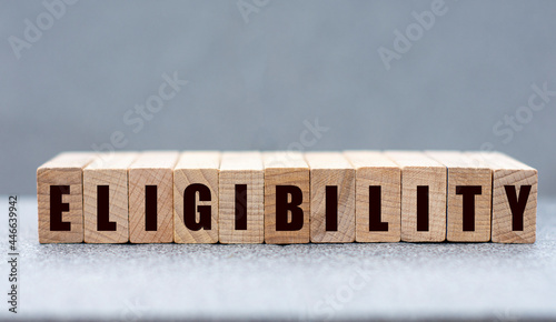 ELIGIBILITY - word on wooden bars on a gray background photo