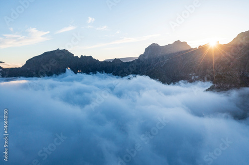 Mountains in a sea of clouds at sunset viewed from Pico Ruivo, Madeira, Portugal photo