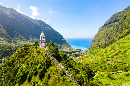 The chapel-tower Nossa Senhora de Fatima on top of green hills, Sao Vicente, Madeira island, Portugal photo