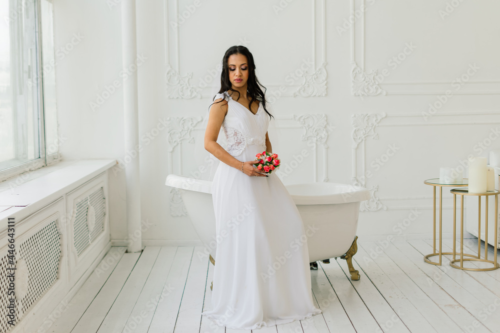 Happy beautiful bride with her veil smiling and excited in interior, wedding morning Happy beautiful bride with her veil smiling and excited in interior, wedding morning