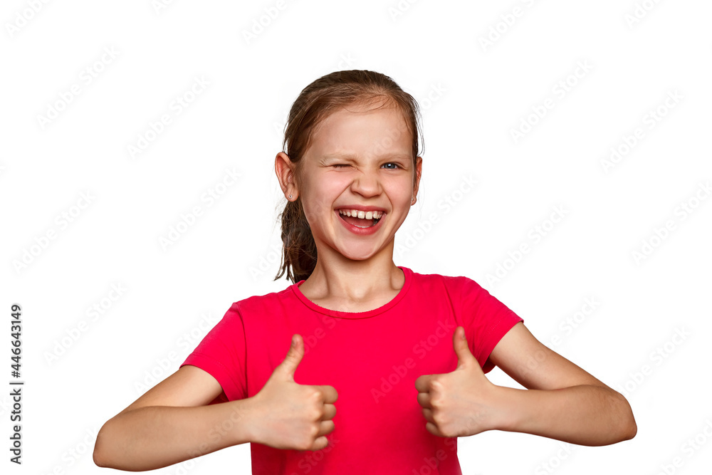 Little girl on a white background holds thumbs up. The child in red smiles and shows that she is all right Little girl on a white background holds thumbs up. The child in red smiles and shows that she is all right
