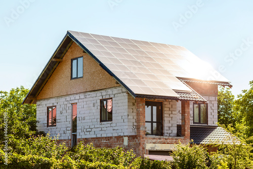 Solar panels on House Roof. Residential private house with solar panels on roof under Construction. Construction Building of aerated concrete
