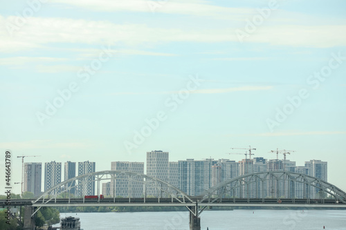 Beautiful view of cityscape with modern buildings and bridge over river