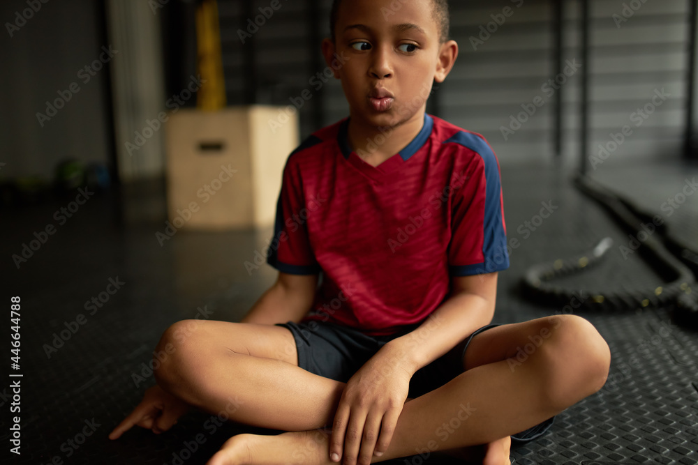 Kid with surprised face did something bad, oops facial expression. Latino american child looking away and point on floor, afraid of punishment. Got in trouble, emotion, scared, sorry, oops concept Kid with surprised face did something bad, oops facial expression. Latino american child looking away and point on floor, afraid of punishment. Got in trouble, emotion, scared, sorry, oops concept
