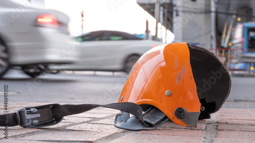 Broken helmet after Motorcycle bike accident on a traffic. Concept of safety transport ration © Montri