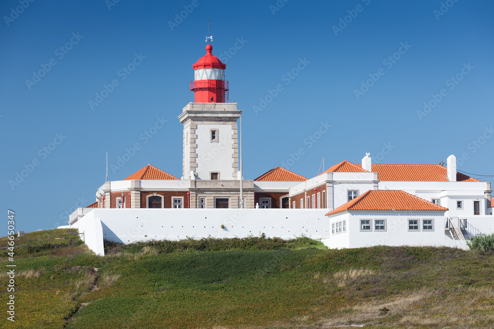 Portugal. Cabo da Roca and the lighthouse over Atlantic Ocean, the most westerly point of the European mainland. Aerial view. Concept for travel in Portugal and most beautiful places in Portugal.
