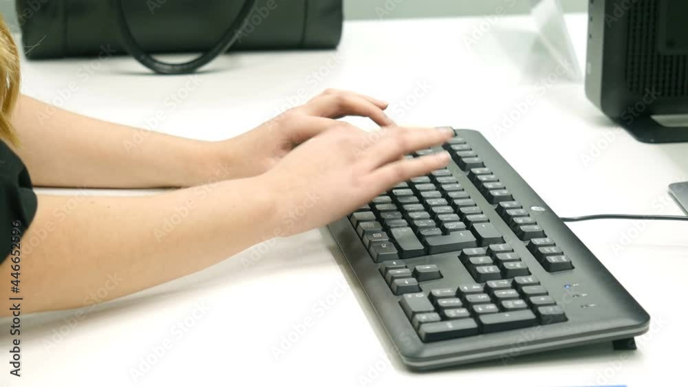Women's hands typing on computer keyboard Women's hands typing on computer keyboard
