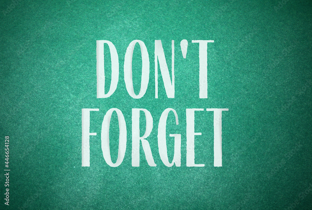 Phrase Don't forget written on green chalkboard Phrase Don't forget written on green chalkboard