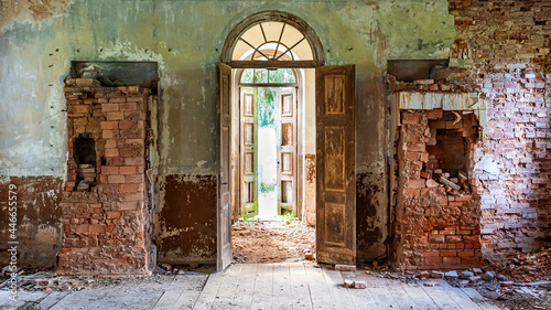 inside interior of an old abandoned church in Latvia  Galgauska  entrance door and damaged brick wall