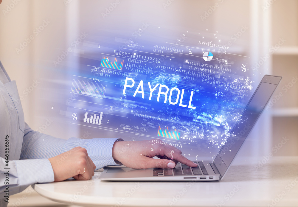 Closeup of businessman hands working on laptop