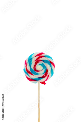 colorful handmade swirl lollipop isolated on white background. multicolored lollipop, Tasty colorful fruit flavored candy. striped lollipop. sweet candy making from sugar on white background. © kanpisut