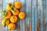 Tangerine or clementines fruits on wood background. Fresh mandar