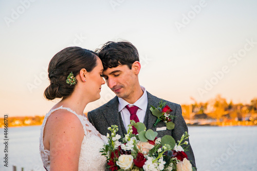 Wedding couple connect at sunset