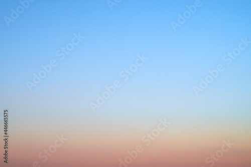blurred sunset evening sky with gradient from blue to yellow, background for summer concepts and designs © AlexLit