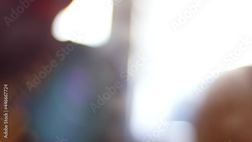 Blurred view of people talk while eating. Sensitive Focus.