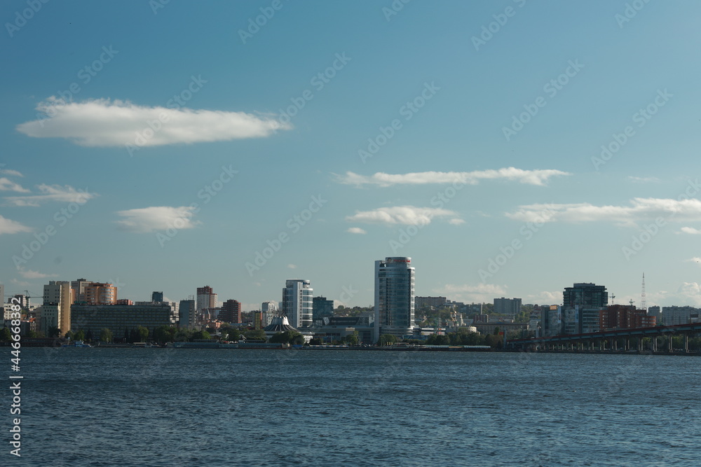 Fototapeta premium A large body of water with a city in the background