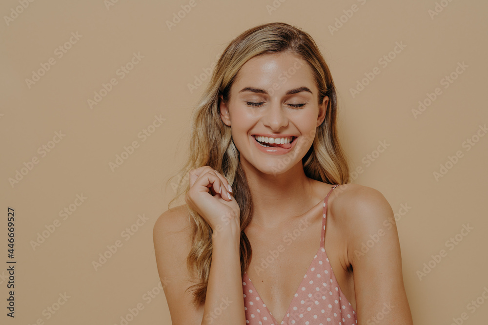 Joyful cheerful young beautiful woman in summer dress laughing at joke Joyful cheerful young beautiful woman in summer dress laughing at joke