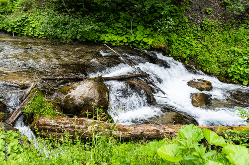 Water coming from 7 springs waterfall (cascada 7 izvoare), Bucegi mountains, Romania. photo