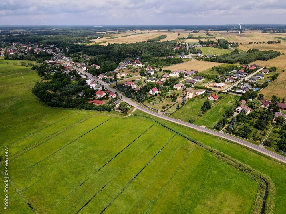 Polish countryside, farm, fields, meadows seen from above - photo drone 