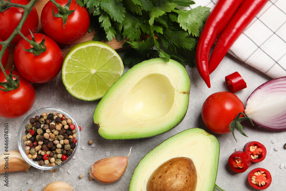 Fresh ingredients for guacamole on light grey table, flat lay Fresh ingredients for guacamole on light grey table, flat lay