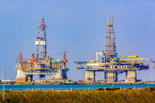 Valokuva Two offshore oil rigs in dry dock at Port Aransas, Texas.