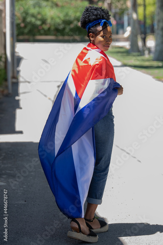 Fotografie Close up of a latin woman wearing the cuban flag smiling at the camera