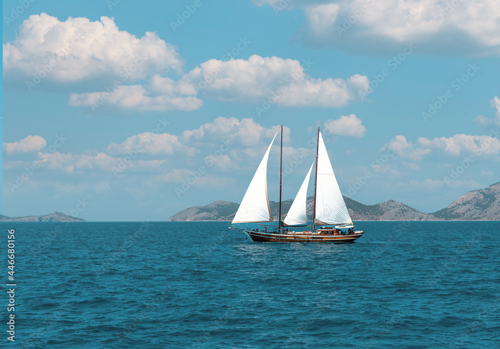 Beautiful sailboat in the Mediterranean Sea  along the greek coast.