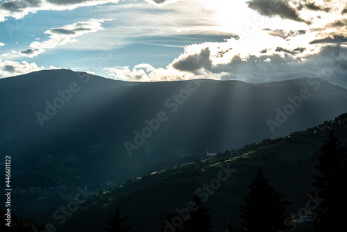 Last sun-rays before sunset surrounding a beautiful church in the dolomites