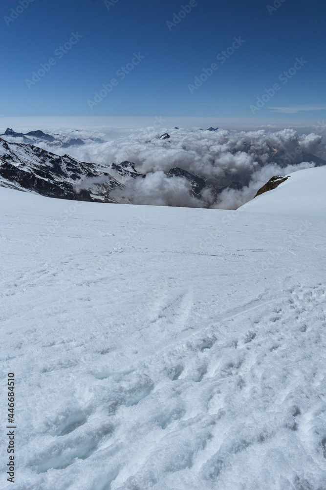 Glaciers and snow between the alps near the matterhorn and Monte Rosa, near the town of Zermatt, Switzerland - June 2021