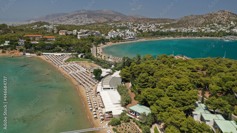 Naklejka premium Aerial drone photo of famous celebrity sandy beach of Astir or Asteras in south Athens riviera with turquoise clear waters, Vouliagmeni, Greece