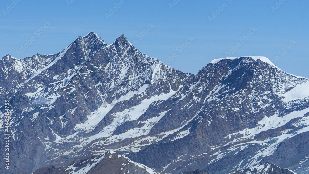 The peaks and glaciers of the Mischabel massif: one of the highest and most spectacular mountain groups of all the Alps seen from the peaks on the border between Italy and Switzerland - June 2021.