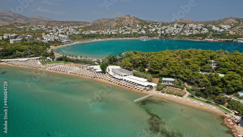 Aerial drone photo of famous celebrity sandy beach of Astir or Asteras in south Athens riviera with turquoise clear waters, Vouliagmeni, Greece