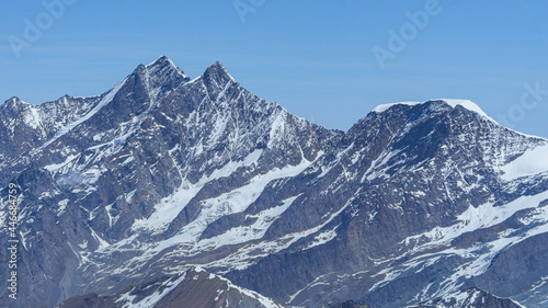 The peaks and glaciers of the Mischabel massif  one of the highest and most spectacular mountain groups of all the Alps seen from the peaks on the border between Italy and Switzerland - June 2021.