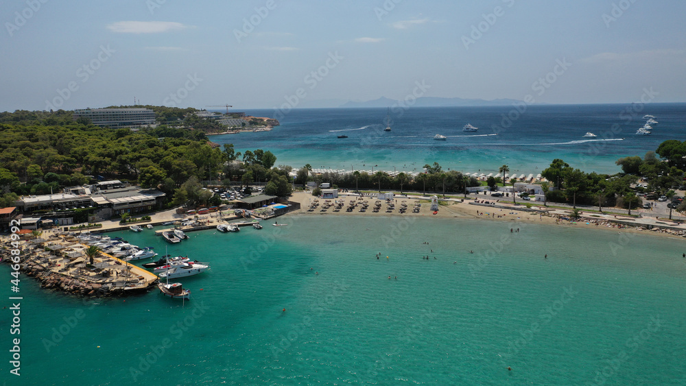 Aerial drone photo of famous celebrity sandy beach of Astir or Asteras in south Athens riviera with turquoise clear waters, Vouliagmeni, Greece