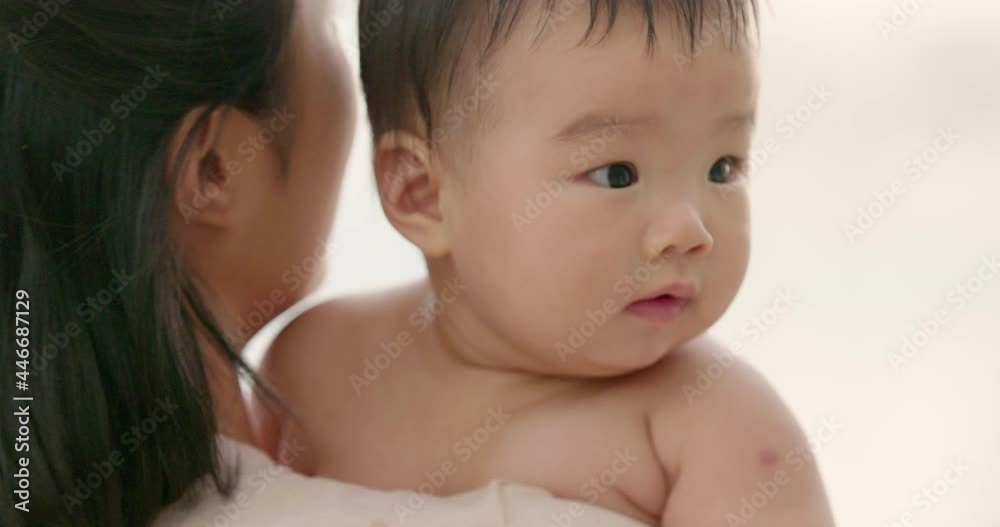 Young mom holding baby girl,4K
