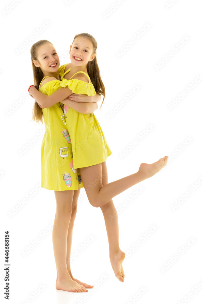 Side View of Barefoot Girls Looking at Each Other Standing on On