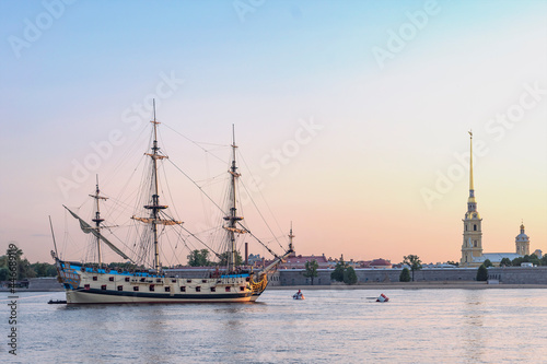 Russian old sailing warship Poltava parked on the Neva against the background of the Peropavloskaya fortress