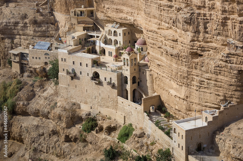 Monastery of Saint George in the canyon, Wadi Qelt, Israel. Temple in the Rocks in the gorge. Judean Desert. Greek Orthodox monastery panoramic view point