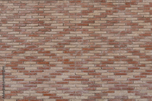 Brick wall with diamond pattern. Orange and red brick wall background. Old red brick texture background. Material for 3D models.