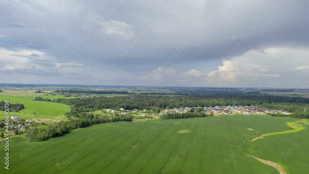 Aerial view of agricultural landscape with fields in summer season. Beautiful rural landscape in bird's-eye view, hyperlapse
Aerial view of agricultural landscape with fields in summer season. Beautiful rural landscape in bird's-eye view, hyperlapse