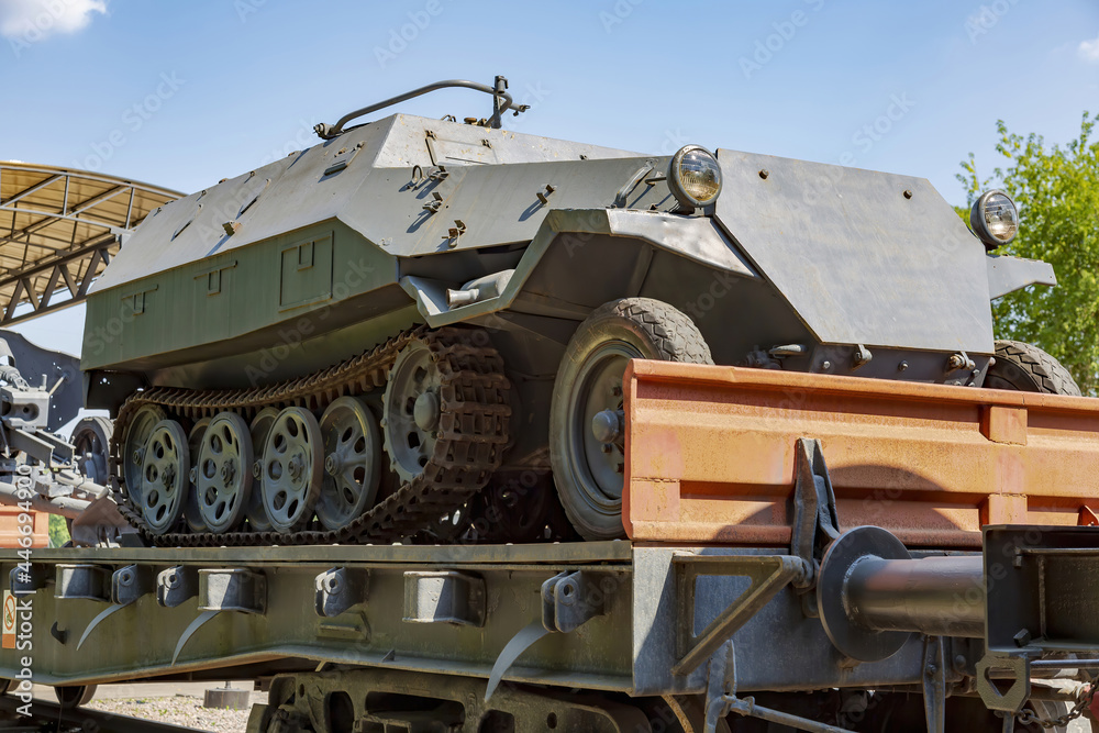 An old khaki armored vehicle for transporting soldiers and conducting combat