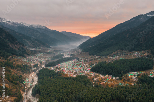 Aerial view of Old Manali township across Beas River at sunset, Himachal Pradesh, India. photo