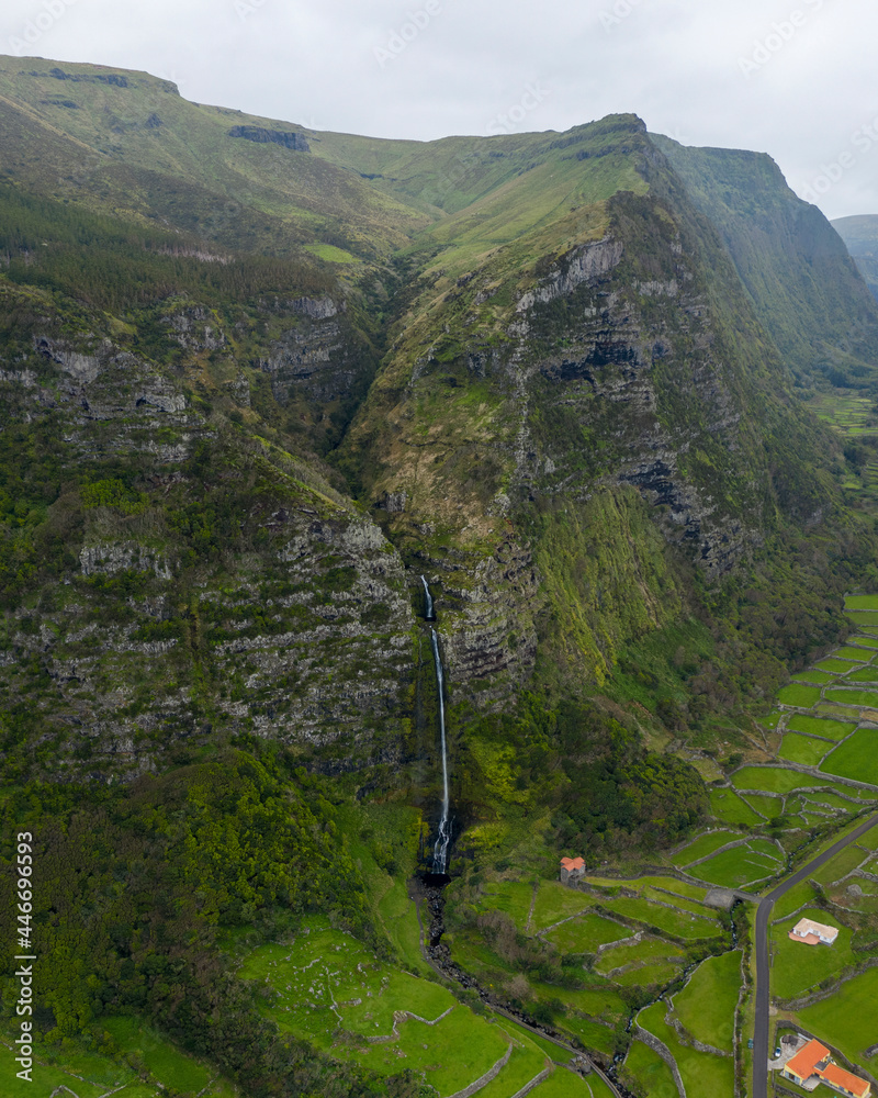 Aerial view of Cascata do Poco do Bacalhau, a beautiful waterfall in Faja Grande, Azores islands Aerial view of Cascata do Poco do Bacalhau, a beautiful waterfall in Faja Grande, Azores islands