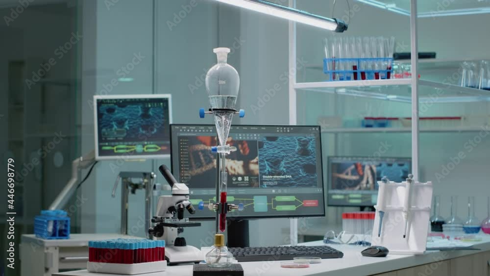 Microbiology laboratory filled with chemical research equipment tools. Test tube for experiment used in pharmaceutical development industry. Microscope, vacutainers, and pipette on desk Microbiology laboratory filled with chemical research equipment tools. Test tube for experiment used in pharmaceutical development industry. Microscope, vacutainers, and pipette on desk