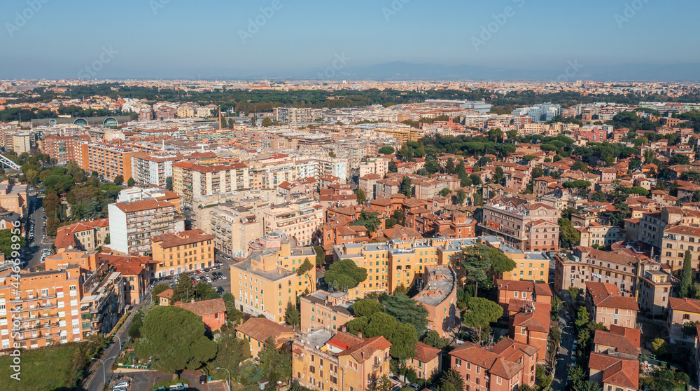 Typical Rome cityscape aerial panorama, Italy. Residential buildings with orange roofs.