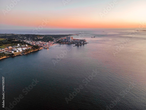 Aerial view of Silopor industrial complex along the Tagus river at sunset, Trafaria, Setubal, Portugal. photo