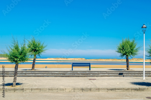 Benches on the seafront in the village of Mogro, Cantabria, northern Spain photo