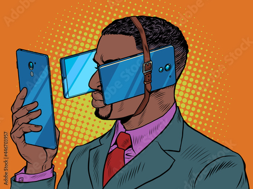 Black man with smartphone. Dependence on gadgets. The phone prevents you from seeing